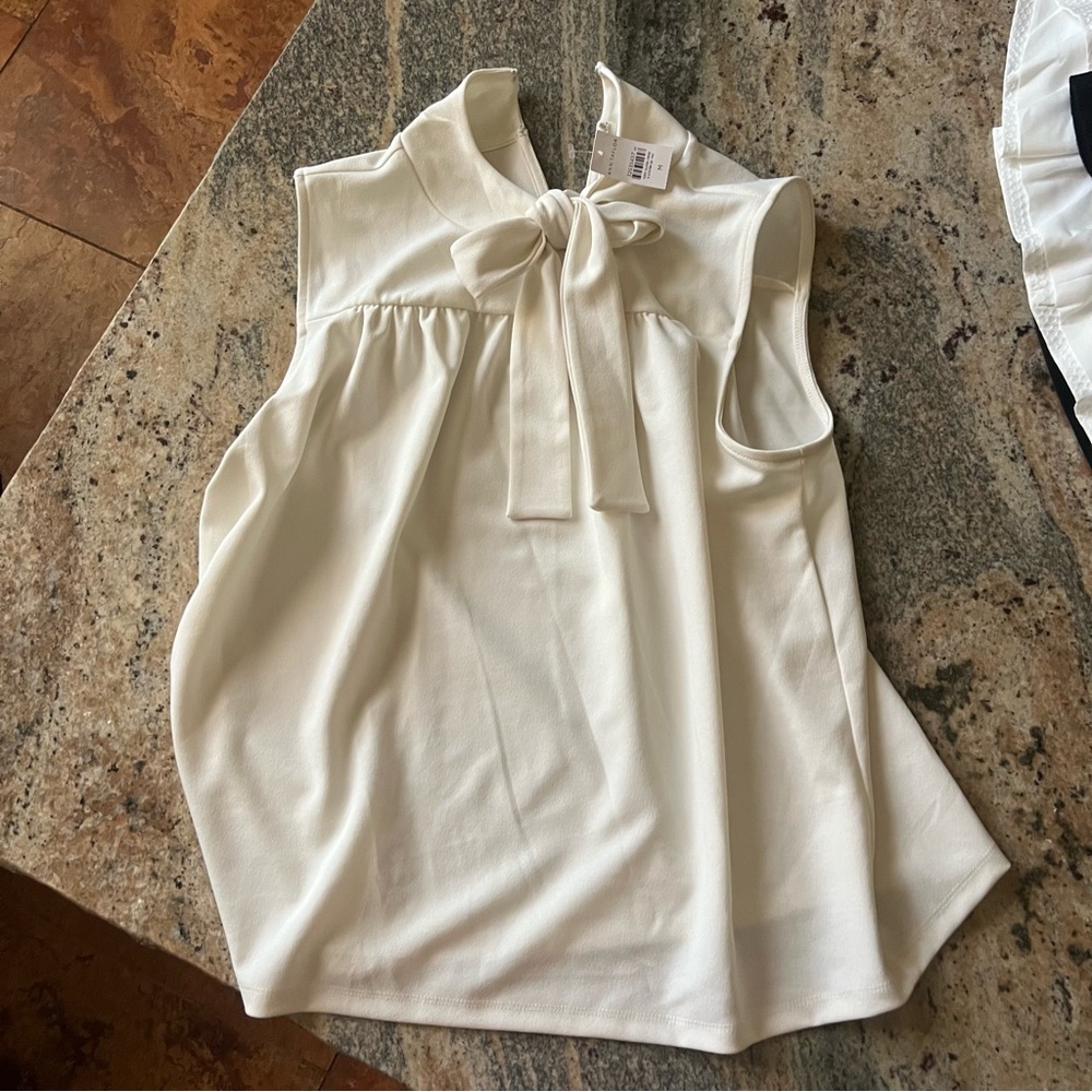 White Ann Taylor top with a bow